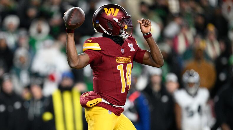 Washington Commanders quarterback Josh Johnson passes against the Philadelphia Eagles during the second half of an NFL football game, Saturday, Dec. 20, 2025, in Landover, Md. (AP Photo/Nick Wass)