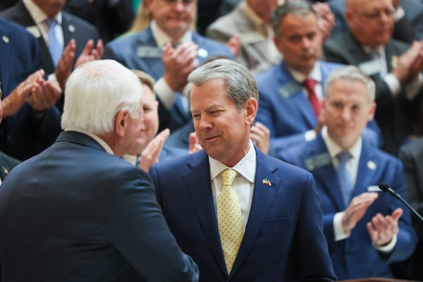 Gov. Brian Kemp (right) greets House Speaker Jon Burns on Monday at the Capitol in Atlanta, where Kemp signed numerous bills.