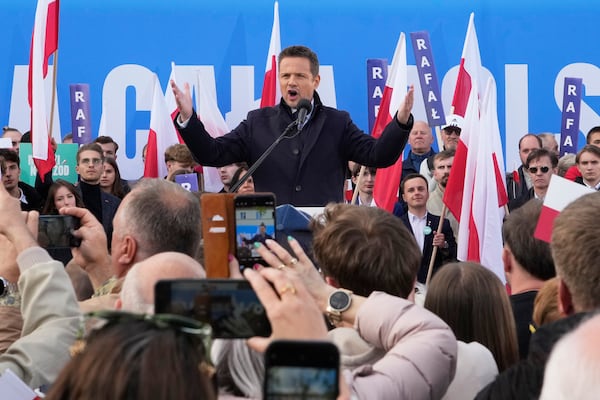 Warsaw Mayor Rafał Trzaskowski, a liberal candidate in Poland's presidential election, speaks to supporters during a campaign stop, in Lodz, Poland, Friday, May 9, 2025. (AP Photo/Czarek Sokolowski)