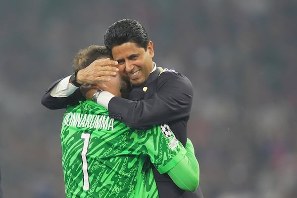 PSG's goalkeeper Gianluigi Donnarumma embraces PSG's President Nasser Al-Khelaifi after the Champions League Final soccer match between Paris Saint Germain and Inter at the Allianz Arena in Munich, Germany, Saturday May 31, 2025 . (Spada/LaPresse via AP)