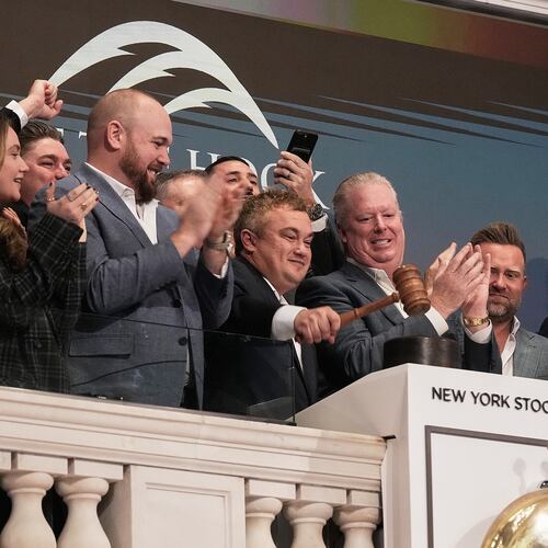 Off The Hook Yachts President Jason Ruegg gavels trading closed at the New York Stock Exchange, Tuesday, Jan. 20, 2026. (AP Photo/Richard Drew)