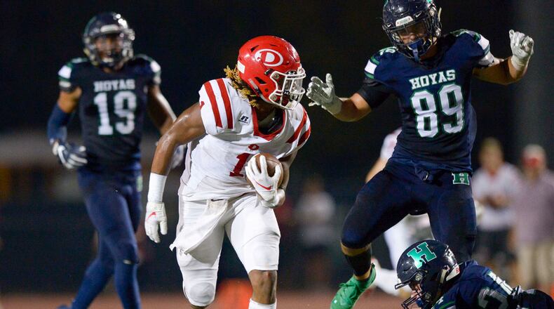 Dalton running back Jahmyr Gibbs (1) avoids the Harrison defense as he gains yardage in the first half of a game at Harrison on Sept. 27. Gibbs continues to lead the state in rushing by a wide margin with 1,964 yards. (Daniel Varnado/Special)