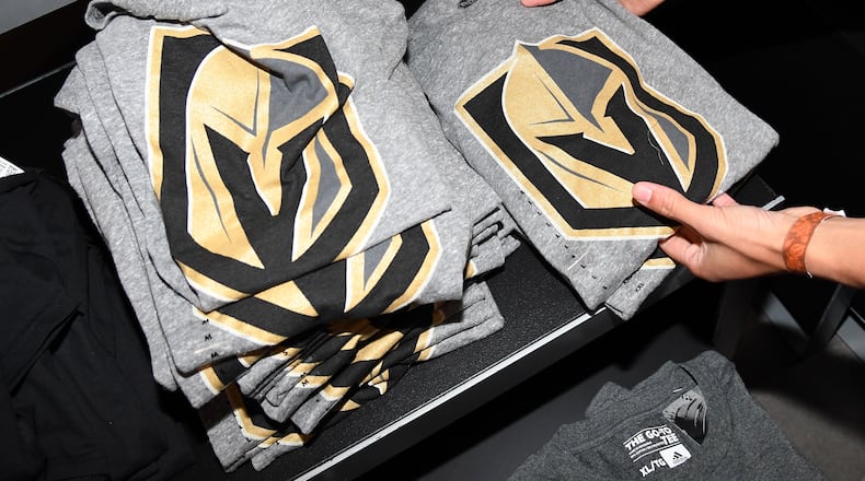 LAS VEGAS, NV - NOVEMBER 22: T-shirts with the team logo for the Vegas Golden Knights are folded and stacked after being announced as the name for the Las Vegas NHL franchise at T-Mobile Arena on November 22, 2016 in Las Vegas, Nevada. The team will begin play in the 2017-18 season. (Photo by Ethan Miller/Getty Images)