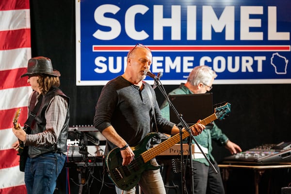 Wisconsin Supreme Court candidate Brad Schimel, center, warms up with his band "4 on the Floor" early at his election night party April 1, 2025, in Pewaukee, Wis. (AP Photo/Andy Manis)