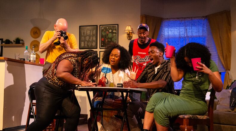 During a card game in "Immediate Family," tensions escalate among the characters played by (from left) Jeff Hathcoat, Kierra Danielle, Irene Polk, Elliott Young, Jason Jamal Ligon and Catherine Campbell. The show continues through March 29.