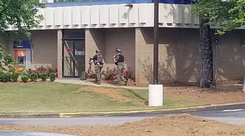 Bank employees told police they saw a man place a backpack in the deposit box.