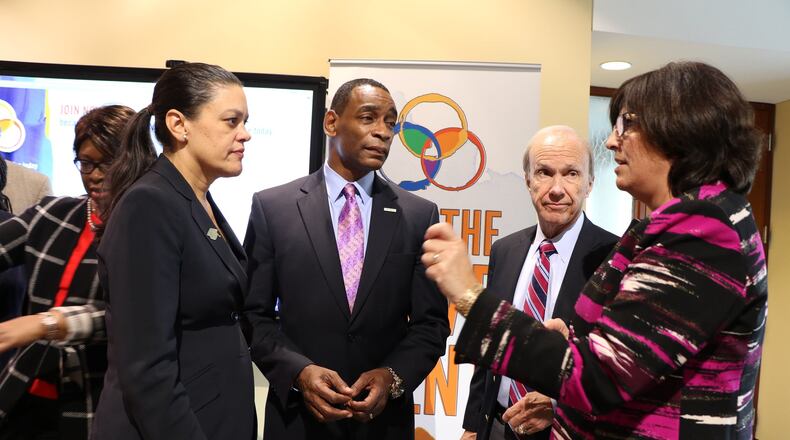 Atlanta Public Schools Superintendent Meria Carstarphen, left, confers with Milton Little, president and CEO of United Way, Dan Kaufman, president and CEO of the Gwinnett Chamber of Commerce, and Pat Falotico, CEO of Greenleaf Center for Servant Leadership, Wednesday at a press conference announcing a new Child Well-being Index. Contributed by Brina Jolin/United Way of Greater Atlanta