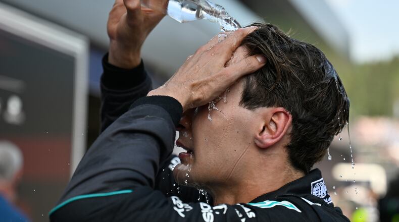 Race winner Mercedes driver George Russell of Britain refreshes himself after the Austrian F1 Grand Prix, in Spielberg, Austria, Sunday, June 28, 2026. (AP Photo/Denes Erdos)