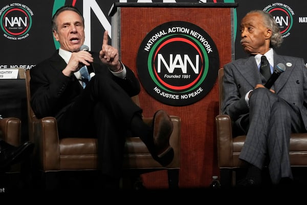New York Mayor candidate Andrew Cuomo, left, speaks, as Rev. Al Sharpton listens, during the New York City Mayoral Candidates Forum at the National Action Network National Convention, Thursday, April 3, 2025, in New York. (AP Photo/Richard Drew)