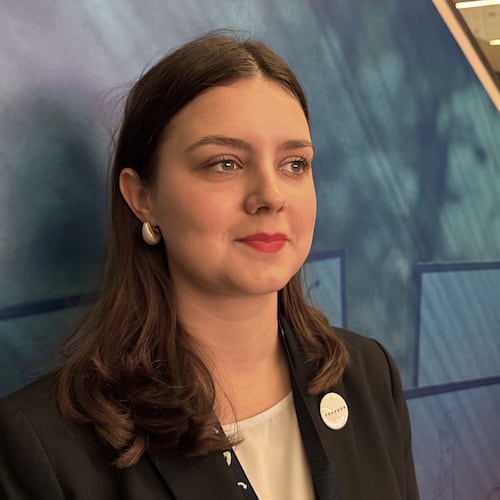 Camdyn Glover, who says she's found a political and cultural home for herself in Turning Point USA, attends the organization's annual conference in Phoenix on Friday, Dec. 19, 2025. (AP Photo/Sejal Govindarao)