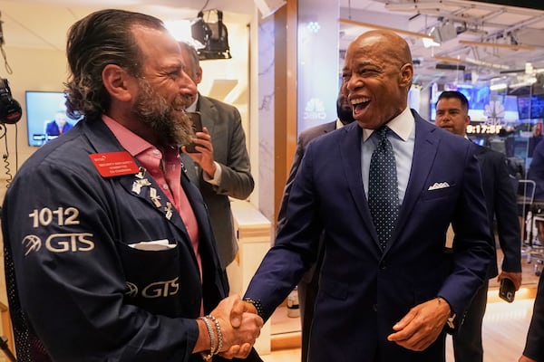 Trader Michael Pistillo, left, meets New York Mayor Eric Adams on the floor of the New York Stock Exchange after Adams was interviewed on CNBC, Friday, June 27, 2025. (AP Photo/Richard Drew)