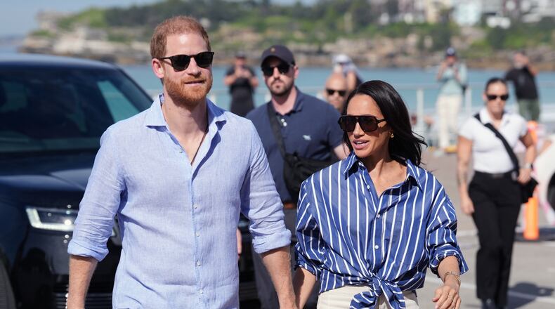 FILE - Prince Harry, and Meghan, the Duke and Duchess of Sussex, arrive for an event, during a visit to Bondi Beach, Australia, April 17, 2026. (Jonathan Brady/Pool Photo via AP, File)
