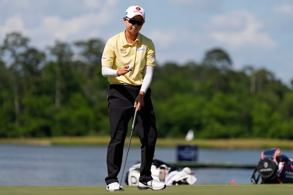 Hyo Joo Kim, of South Korea, celebrates on the 18th green during the final round the Chevron Championship LPGA golf tournament Sunday, April 27, 2025, in The Woodlands, Texas. (AP Photo/Ashley Landis)
