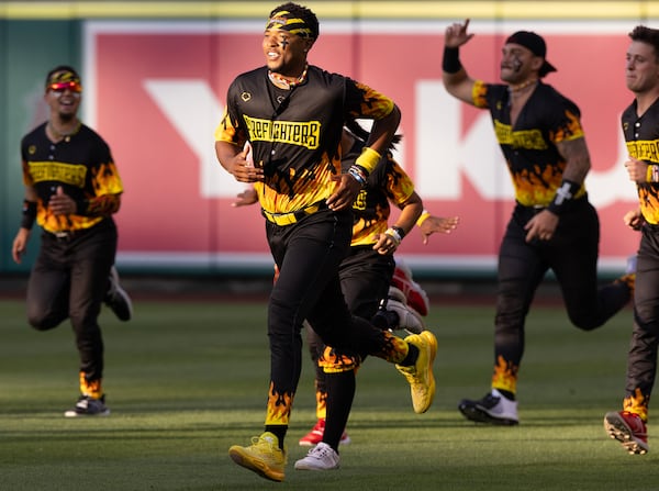 The Firefighters run on the field before taking on the Savannah Bananas at Angel Stadium on Friday, May 30, 2025, in Anaheim, California. (Luke Johnson/Los Angeles Times/TNS)