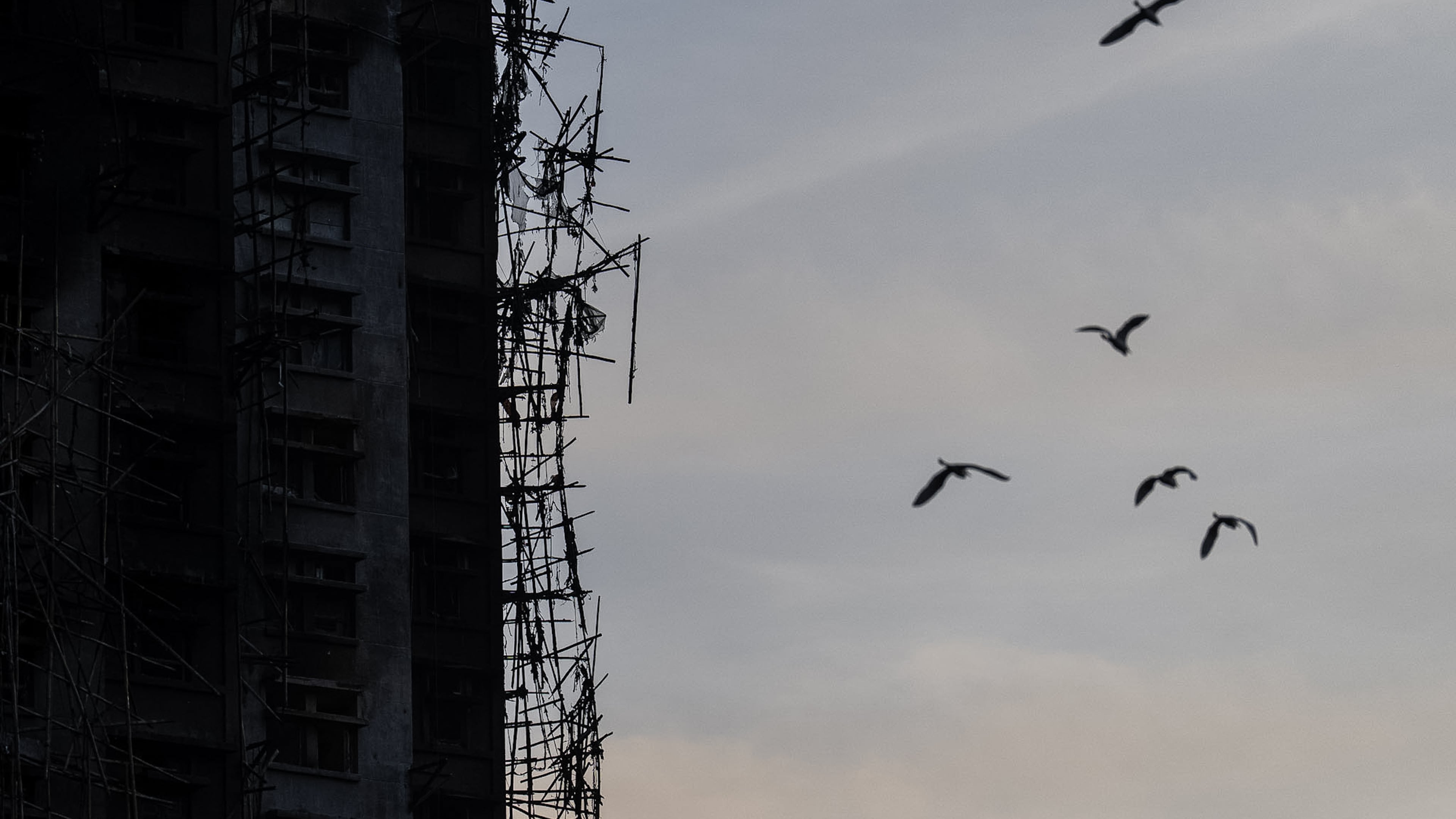 A burned building is seen at the scene of the fire that started Wednesday at Wang Fuk Court, a residential estate in the Tai Po district of Hong Kong's New Territories, Friday, Nov. 28, 2025. (AP Photo/Chan Long Hei)