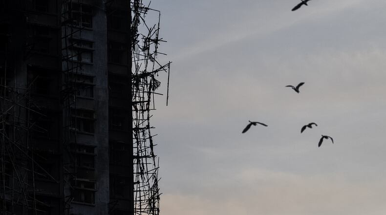 A burned building is seen at the scene of the fire that started Wednesday at Wang Fuk Court, a residential estate in the Tai Po district of Hong Kong's New Territories, Friday, Nov. 28, 2025. (AP Photo/Chan Long Hei)