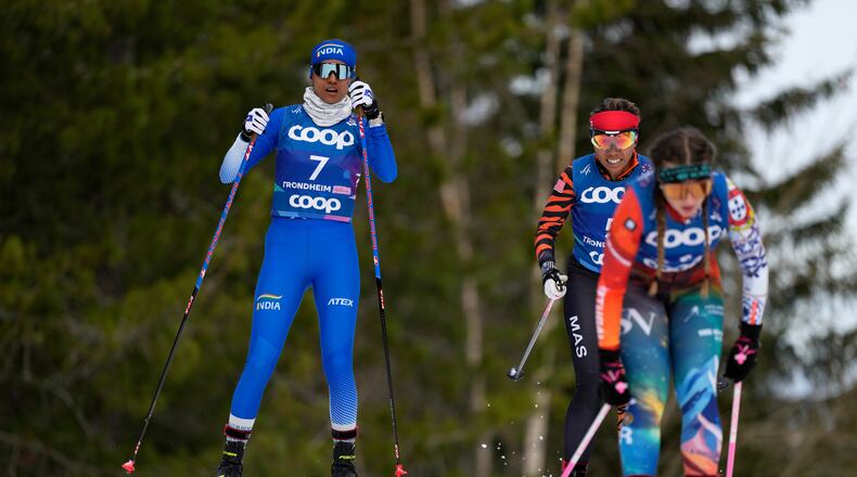 FILE - Bhavani Thekkada Nanjunda, of India, Khadijah Ismail, of Malaysia, and Mariana Cabrita, of Portugal, from left, compete in the cross-country women's 7.5 km Interval Start Classic qualification race at the Nordic World Ski Championships in Trondheim, Norway, Feb. 26, 2025. (AP Photo/Matthias Schrader, File)
