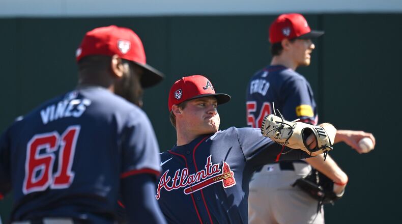Braves starting pitcher Bryce Elder (center) throws a ball during spring training baseball workouts at CoolToday Park, Thursday, February, 15, 2024, in North Port, Florida. (Hyosub Shin / Hyosub.Shin@ajc.com)