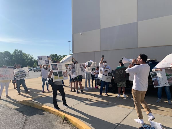 Cross Keys High School students and community members protest deteriorating building conditions at their school, and at others in the region, outside a DeKalb County Board of Education meeting on Monday, May 9, 2022, in Stone Mountain. (Cassidy Alexander/AJC)
