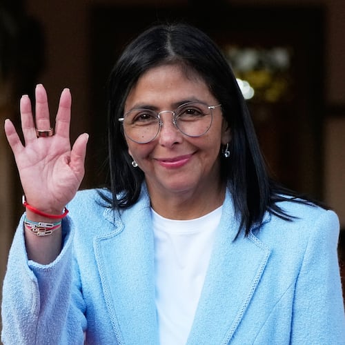 FILE - Venezuela's acting President Delcy Rodriguez waves after bidding farewell to U.S. Energy Secretary Chris Wright following their meeting at Miraflores Palace in Caracas, Venezuela, Feb. 11, 2026. (AP Photo/Ariana Cubillos, File)