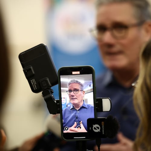 Britain's Prime Minister Keir Starmer speaks to members of the media during a visit to a "family hub" at St. Mary's Church Hall in Goldington, Bedfordshire, north of London, Thursday, Jan. 8, 2026. (Henry Nicholls/Pool Photo via AP)