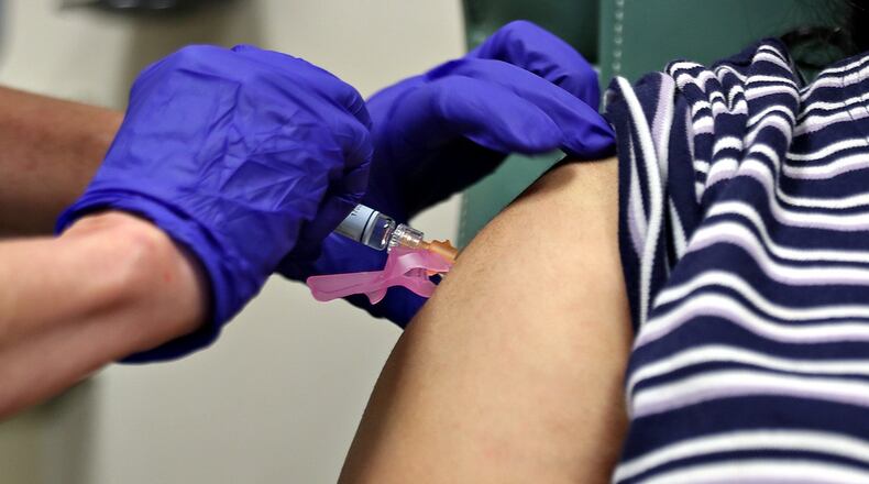 Flu vaccinations ended up playing an important role in fighting the disease’s spread this year. (PHOTO by Daulton Venglar/AMERICAN-STATESMAN)