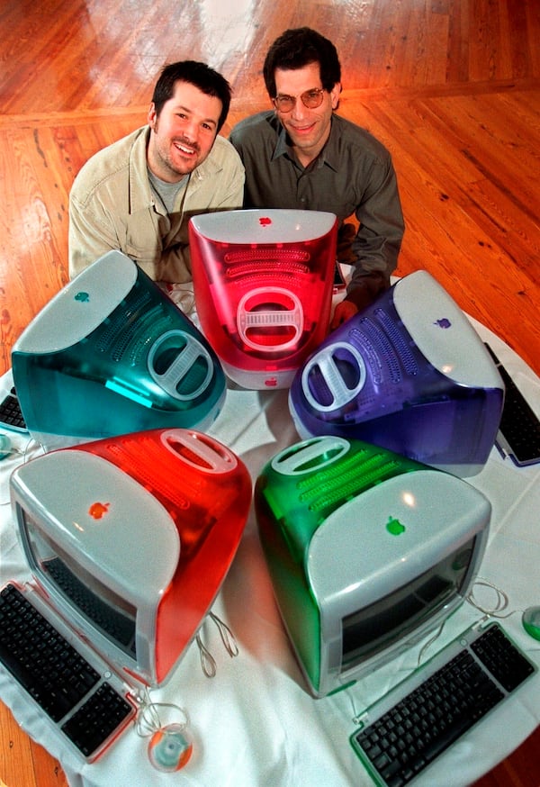 FILE - This March 19, 1999 file photo shows Jonathan Ive, left, Apple Computer's vice president of design, and Jon Rubinstein, Apple's senior vice president of engineering, posing behind five iMac personal computers at Apple headquarters in Cupertino, Calif. (AP Photo/Susan Ragan, file)