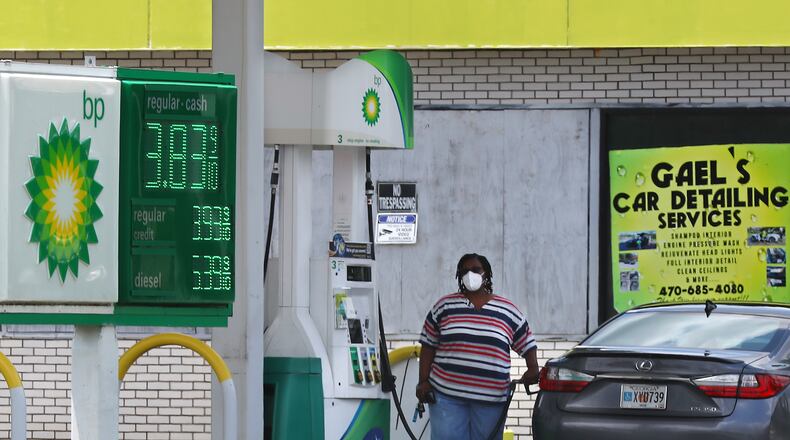 071322 Conyers: A motorist gases up her vehicle with prices as low as 3.83 a gallon at the BP station on Salem Road on Wednesday, July 13, 2022, near Conyers. “Curtis Compton / Curtis Compton@ajc.com”