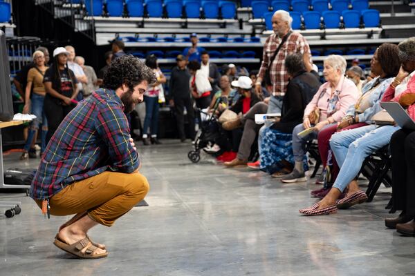 Zachary Perry, parliamentarian for NPU-V, takes a moment during a contentious, three-hour meeting where the NPU voted to recommend against a city of Atlanta change that would allow a data center to be built in Adair Park on Monday, April 13, 2026. (Ben Gray for the AJC)