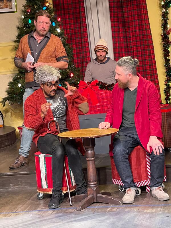 Topher Payne watches improvisers Freddy Boyd and Kevin Gillese rehearse a scene from “Y’allmark.” In the background is pianist Justin Geer.