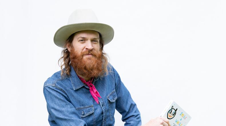 Artist Kyle Brooks, aka BlackCatTips, debuts a mini art book for kids and art lovers alike. CONTRIBUTED BY AMANDA GREENE PHOTOGRAPHY