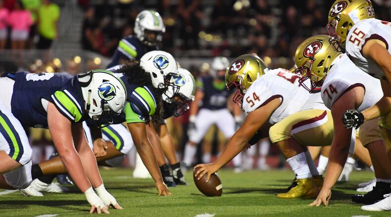 Friday Night football: The Northview defense prepares to battle the Johns Creek offense in the trenches during Friday's matchup in Johns Creek. (John Amis/Special)