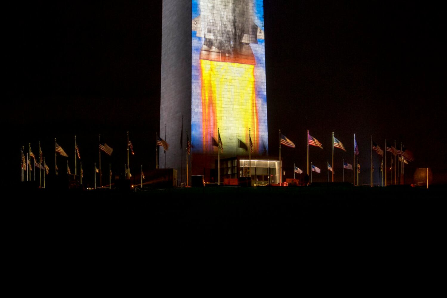 Photos: Apollo 11 Saturn V rocket lights up Washington Monument