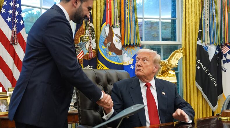 President Donald Trump shakes hands with New York City Mayor-elect Zohran Mamdani in the Oval Office of the White House, Friday, Nov. 21, 2025, in Washington. (AP Photo/Evan Vucci)