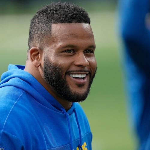 FILE - Los Angeles Rams defensive tackle Aaron Donald warms up before an NFL football game against the Cleveland Browns, Dec. 3, 2023, in Inglewood, Calif. (AP Photo/Mark J. Terrill, File)