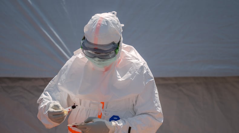 FILE - A health worker prepares a patient's blood sample for testing at Bunia General Hospital in Bunia, Congo, Thursday, June 11, 2026. (AP Photo/Moses Sawasawa, File)