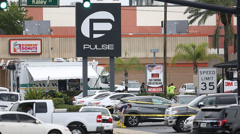 ORLANDO, FL - JUNE 12: Law enforcement officials investigate near the Pulse Nightclub where Omar Mateen allegedly killed at least 50 people on June 12, 2016 in Orlando, Florida. The mass shooting killed at least 50 people and injuring 53 others in what is the deadliest mass shooting in the country's history.  (Photo by Joe Raedle/Getty Images)