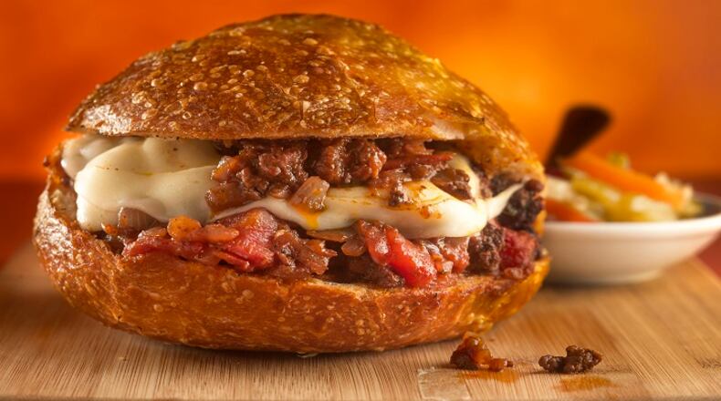 A sloppy Giuseppe (the classic sloppy Joe but with Italian accents like red wine, oregano, provolone and giardiniera) goes great with red wines like a Tuscan blend, a Rhone or a Rioja.  (Bill Hogan/Chicago Tribune/TNS)