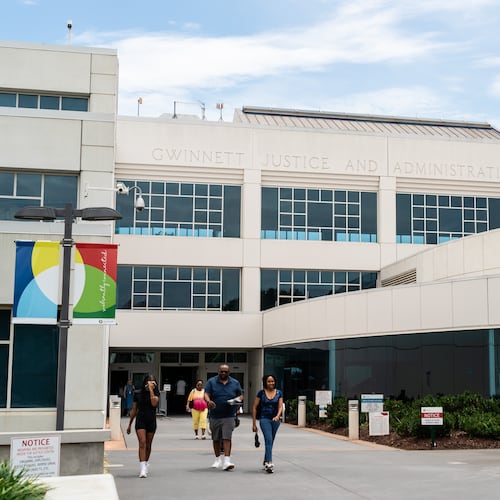People exit the Gwinnett Justice & Administration Center in Lawrenceville, Georgia, on Friday, July 19, 2024. (Seeger Gray/AJC)