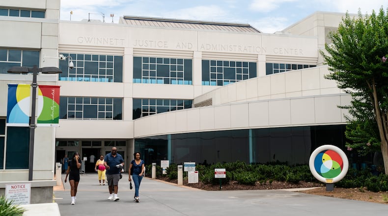 People exit the Gwinnett Justice & Administration Center in Lawrenceville, GA on Friday, July 19, 2024. (Seeger Gray / AJC)