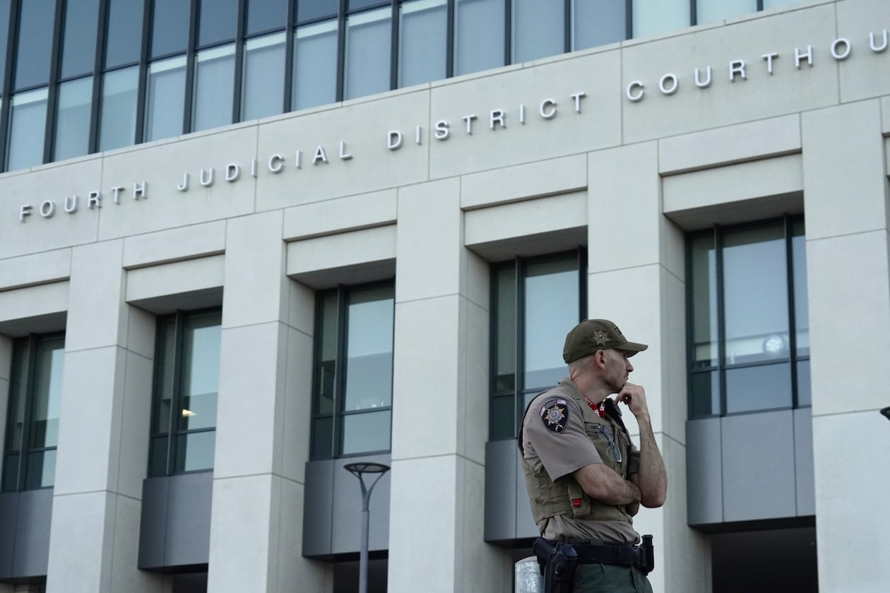 law enforcement monitors the parking lot outside the fourth judicial District courthouse where a preliminary hearing for Tyler Robinson, the Utah man accused of fatally shooting Charlie Kirk, in Provo, Utah, Friday, July 10, 2026. (AP Photo/Ty ONeil)