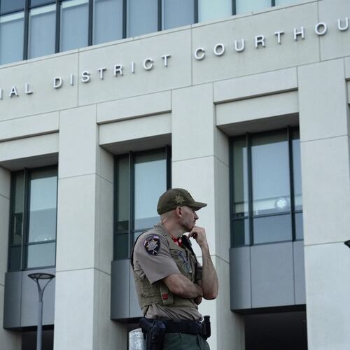 law enforcement monitors the parking lot outside the fourth judicial District courthouse where a preliminary hearing for Tyler Robinson, the Utah man accused of fatally shooting Charlie Kirk, in Provo, Utah, Friday, July 10, 2026. (AP Photo/Ty ONeil)
