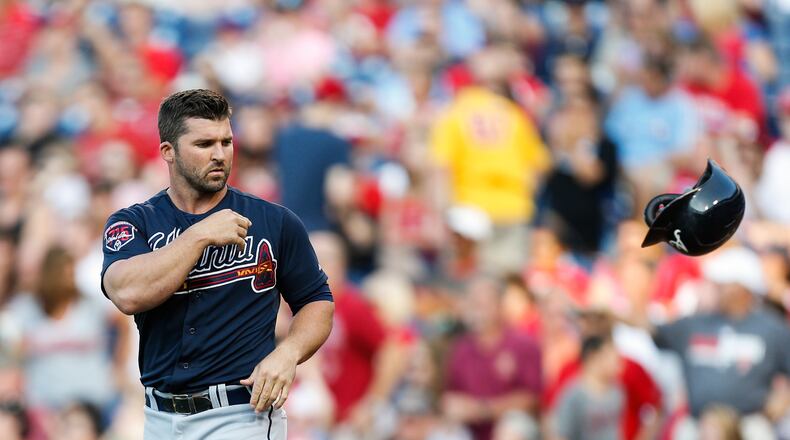 PHILADELPHIA, PA - JUNE 27: Dan Uggla #26 of the Atlanta Braves tosses his helmet after striking out in the first inning of the game against the Philadelphia Phillies at Citizens Bank Park on June 27, 2014 in Philadelphia, Pennsylvania. (Photo by Brian Garfinkel/Getty Images)