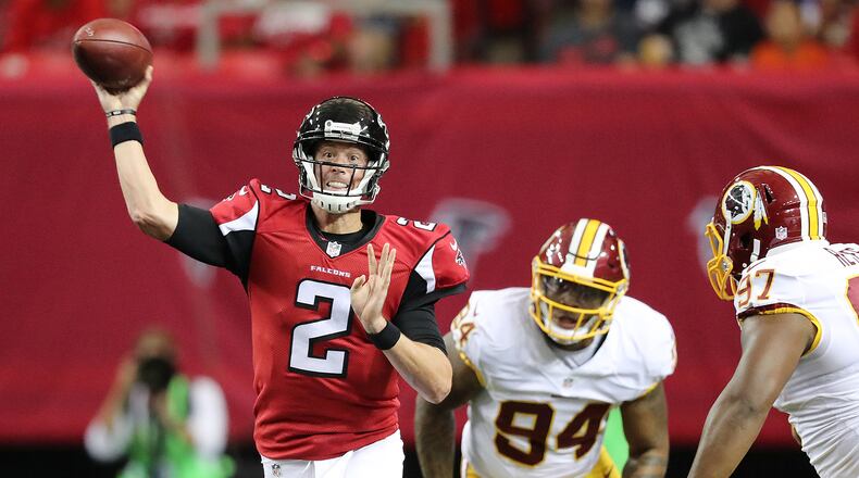 Falcons quarterback Matt Ryan throws an incomplete pass under pressure from Washington linebacker Preston Smith to go three and out in the first quarter of Thursday night's exhibition game. (Curtis Compton /ccompton@ajc.com)