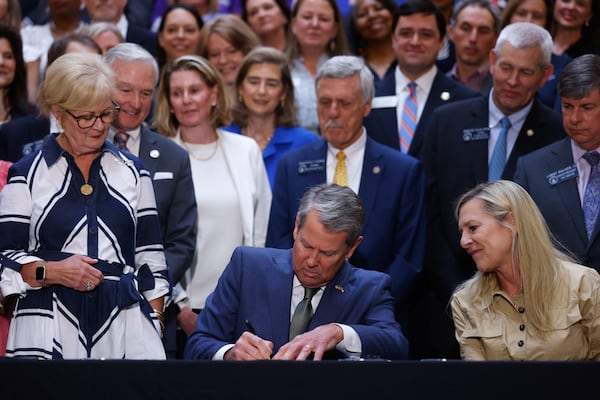 Gov. Brian Kemp signed a series of education bills at the Capitol earlier this month, including a school literacy bill. (Arvin Temkar/AJC)
