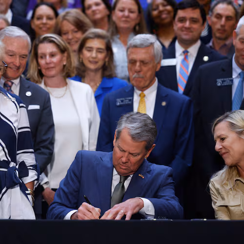 Gov. Brian Kemp signs a series of education bills at the Capitol in Atlanta on May 5, 2026, including a school literacy bill. The bill provides training and support for educators, requires screening for dyslexia and other learning disabilities and mandates kindergarten attendance. (Arvin Temkar/AJC)