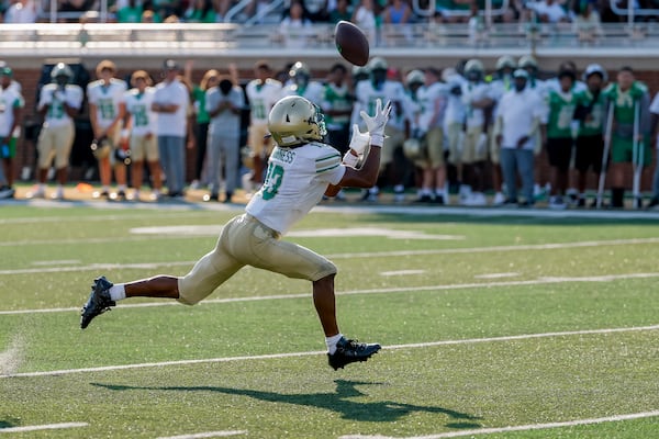 Buford's Braylon Williams stretches out to try to haul in a pass against Gainesville on Saturday, Aug. 22, 2026, in Buford. Williams did not come down with the catch. (Erik S. Lesser for the AJC)