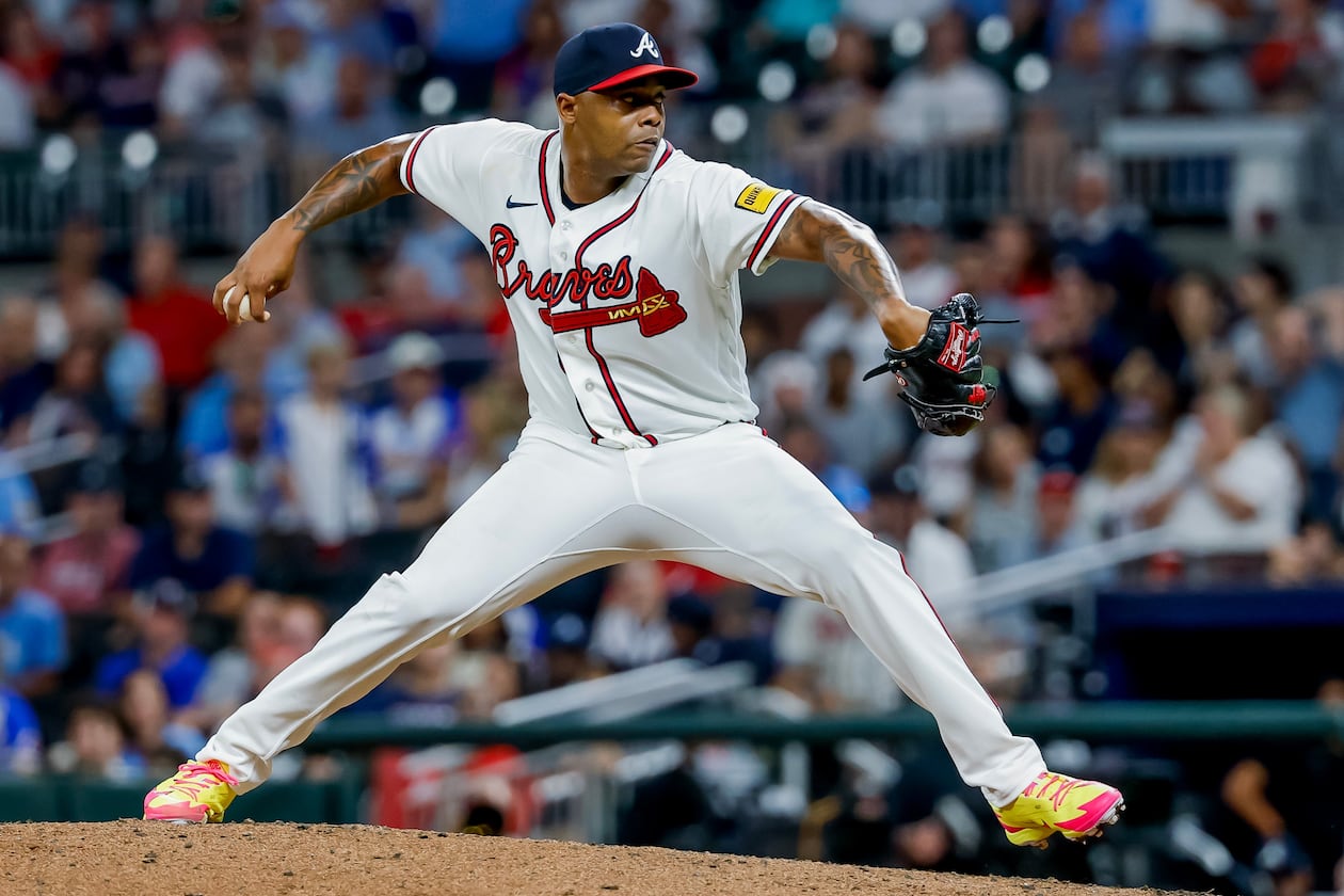 Atlanta Braves pitcher Raisel Iglesias (26) delivers to a Los Angeles Dodgers batter during the ninth inning of a baseball game, Tuesday, Aug. 25, 2026, in Atlanta. (AP Photo/Erik S. Lesser)