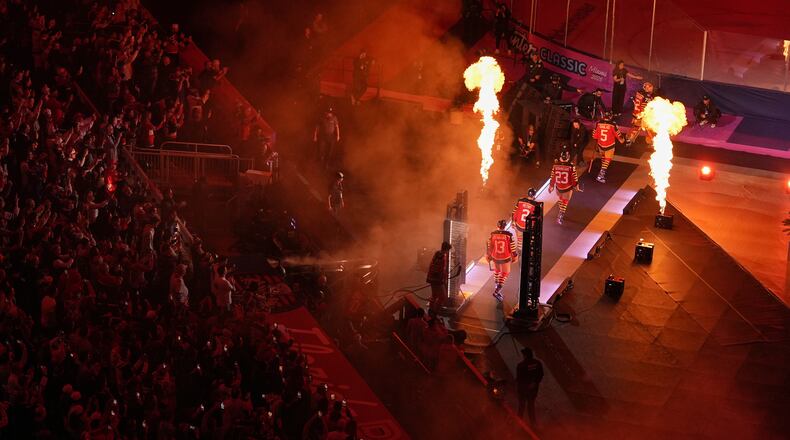 Florida Panthers players walk to the ice before the NHL Winter Classic outdoor hockey game between the Florida Panthers and the New York Rangers, Friday, Jan. 2, 2026, in Miami. (AP Photo/Rebecca Blackwell)