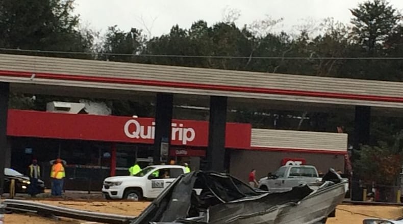 A QuikTrip is closed off Mableton Parkway after a piece of roofing fell into the roadway.